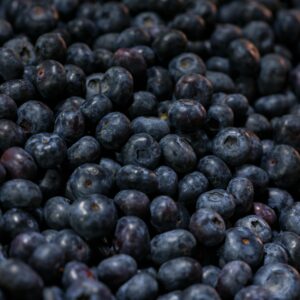 A detailed close-up of fresh, ripe blueberries showing texture and freshness.