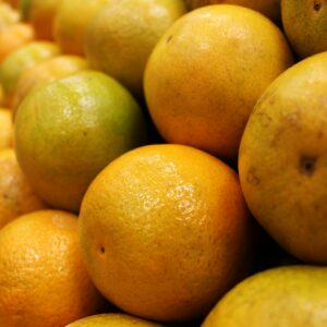 Vibrant fresh oranges stacked in rows, showcasing their juicy and nutritious appeal.