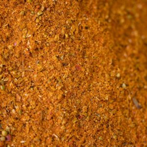 High-resolution close-up of a brown spice and herb blend, perfect for cooking and seasoning.